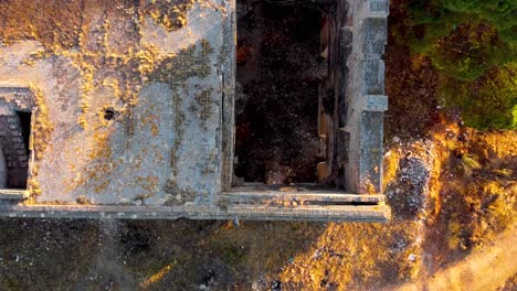 slow motion overhead view of the monastery of carmona with a crane shot showing the landscape on the horizon