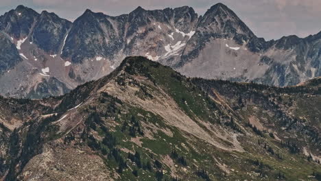 Mt-Revelstoke-BC-Canada-Aerial-v6-zoomed,-high-altitude-drone-flyover-capturing-the-wilderness-landscape-of-rugged-terrain-and-majestic-peaks-of-the-mountains---Shot-with-Mavic-3-Pro-Cine---July-2023