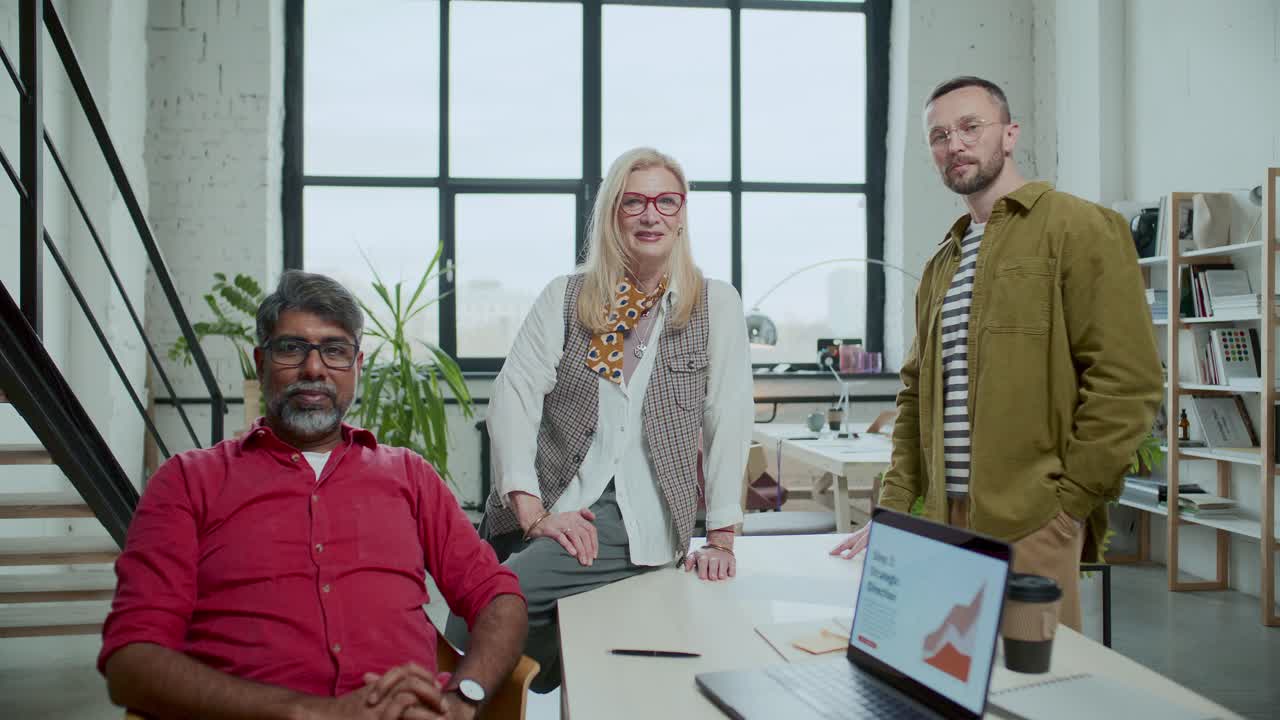 Team of Diverse Colleagues Posing for Camera in Modern Office