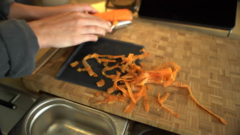 Close-Up-of-Female-Hands-Peeling-a-Carrot