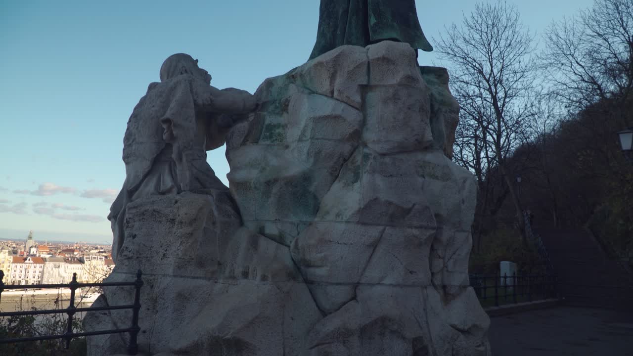 Rear View Of Saint Gellert Monument Situated At Gellert Hill In Budapest Hungary - Tilt Up Pan Shot