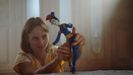 a girl playing with dolls in her room