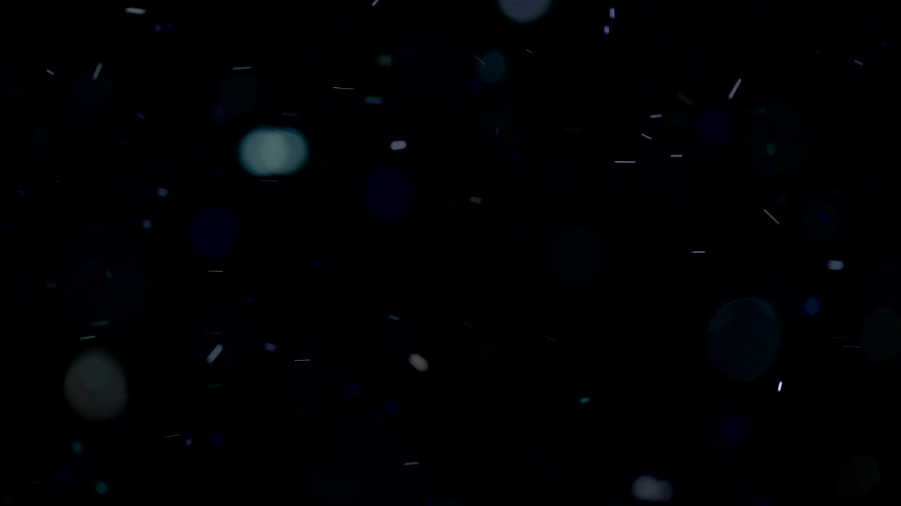 Dust particles falling. Close up.