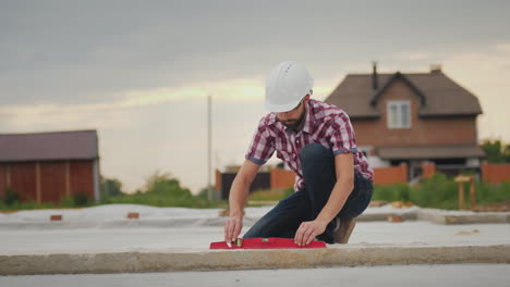 The-Young-Engineer-Checks-The-Accuracy-Of-The-Work-On-The-Construcción-Of-The-Foundation-Inspects-Th