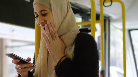 Woman in hijab using mobile phone 4k