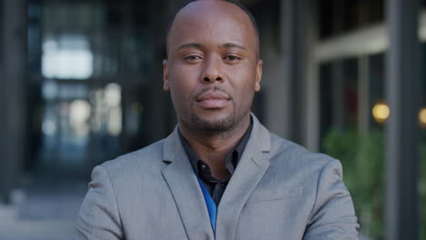 portrait young successful black businessman looking serious arms crossed confident african american entrepreneur enjoying professional lifestyle success