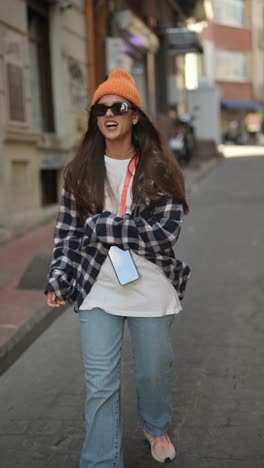 stylish woman walking on city street