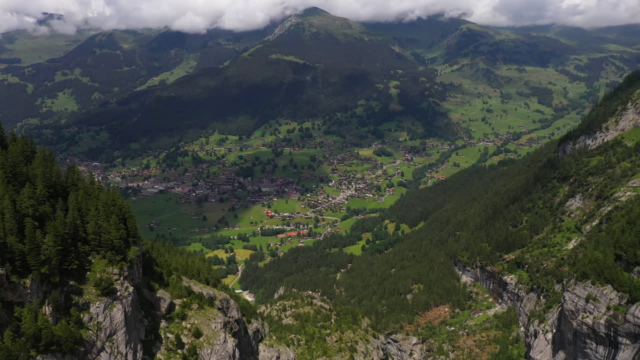 Wide drone shot of descending into Grindelwald, in Switzerland’s Bernese Alps