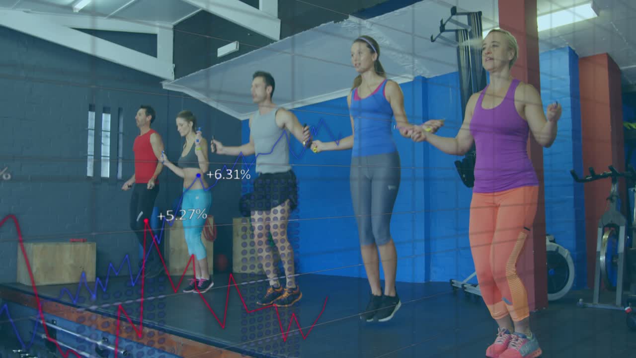 Five adults in fitness class starting on cue, jumping rope to monitor cardio as charts overlay