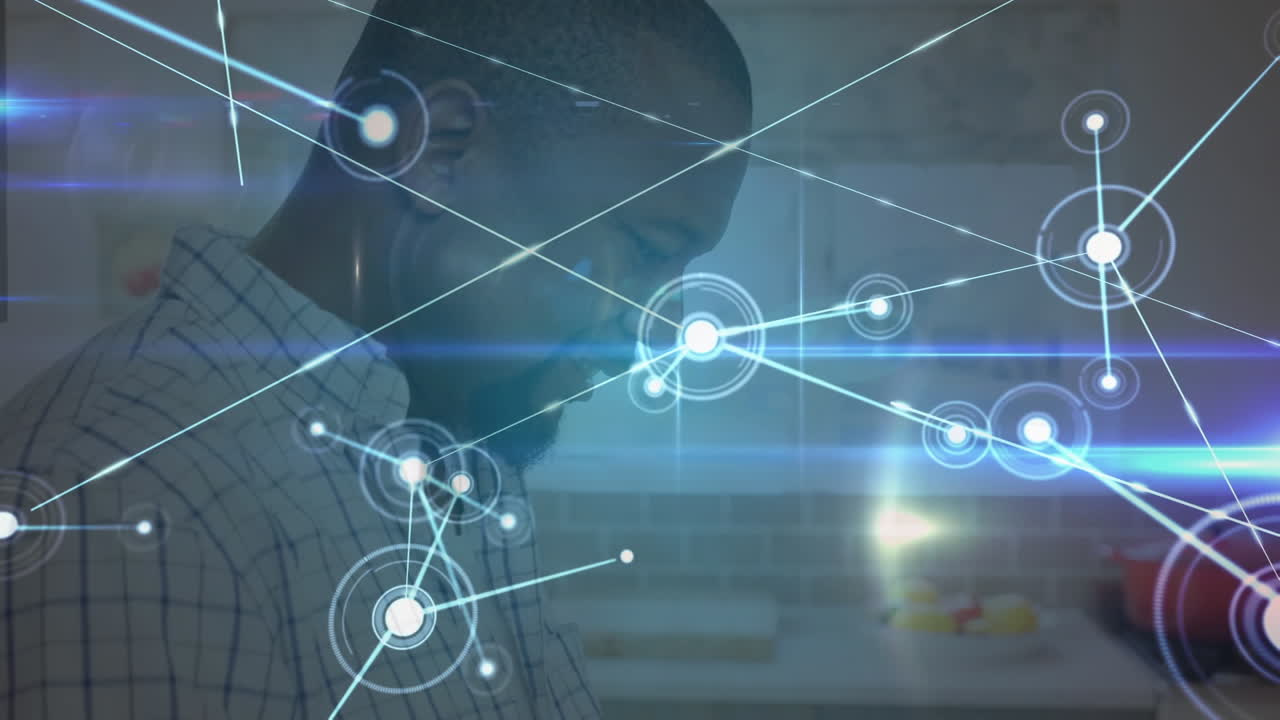 Animation of networks of connections with icons over man using tablet