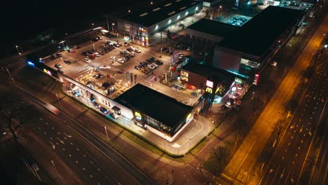 Aerial-hyperlapse-showing-buildings,-cars-and-city-landscape