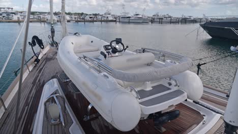 Tender-on-foredeck-of-Oyster-82-luxury-sailboat-moored-in-port