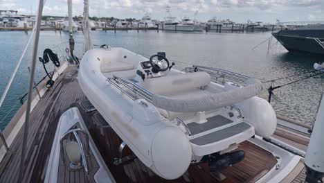 tender on foredeck of oyster 82 luxury sailboat moored in port