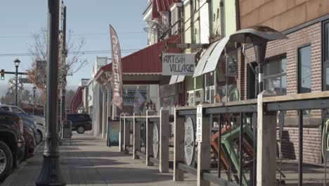 Artisan-Village-store-in-downtown-Grayling,-Michigan-with-stable-establishing-shot