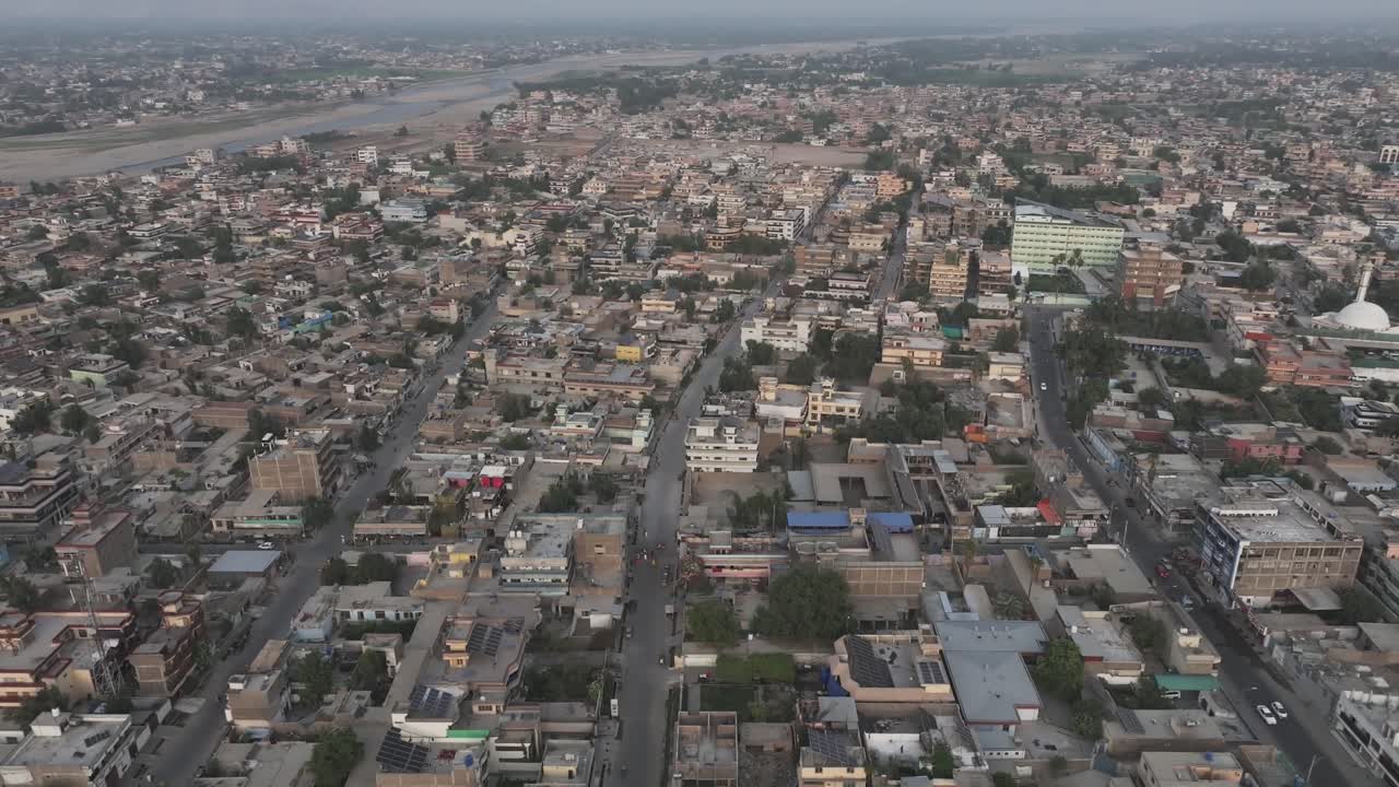 Jalalabad Drone Aerial of city center, Nangarhar, Afghanistan. View of City Street Traffic and Downtown Buildings