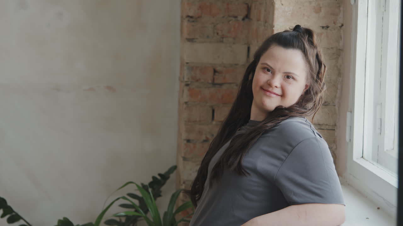 Young Woman With Down Syndrome Smiling To Camera