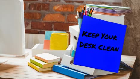 Animation-of-keep-your-desk-clean-text-on-memo-note-over-stationery-items-on-desk