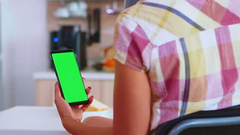 Woman-using-smartphone-with-chroma-key