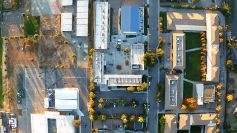 aerial top-down view of a suburban neighborhood and school campus