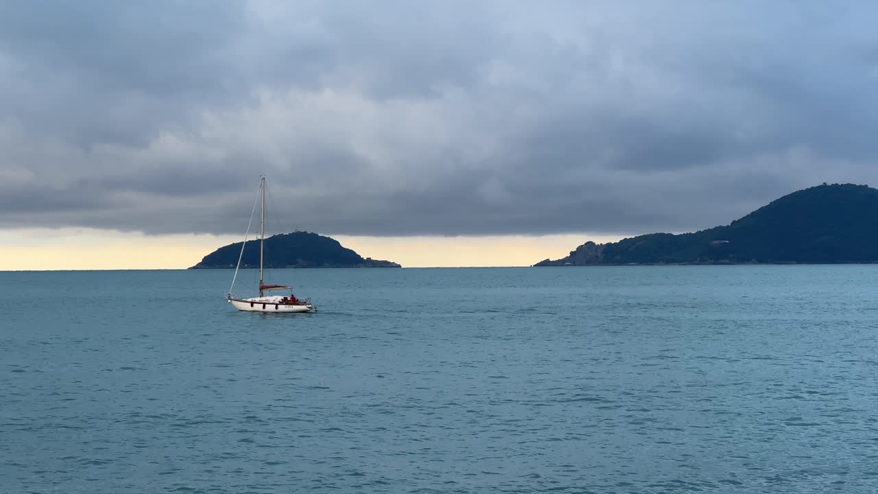 Sail Booat and Light house before the storm