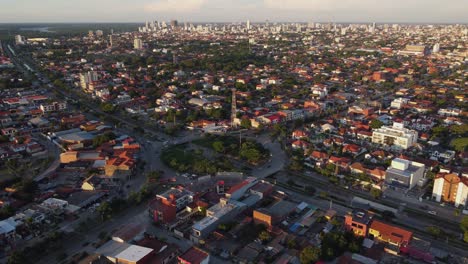 Golden-hour-aerial:-Cars-on-urban-traffic-circle-in-Santa-Cruz-Bolivia