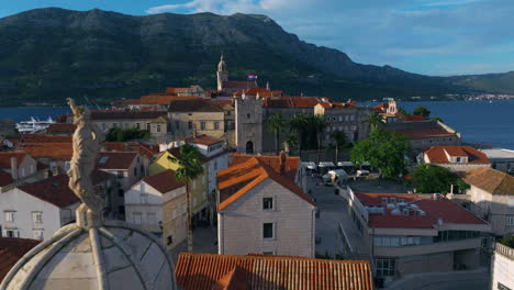Croatian Flag Atop On Town Gate In Korcula Old Town, Croatia. - pullback shot