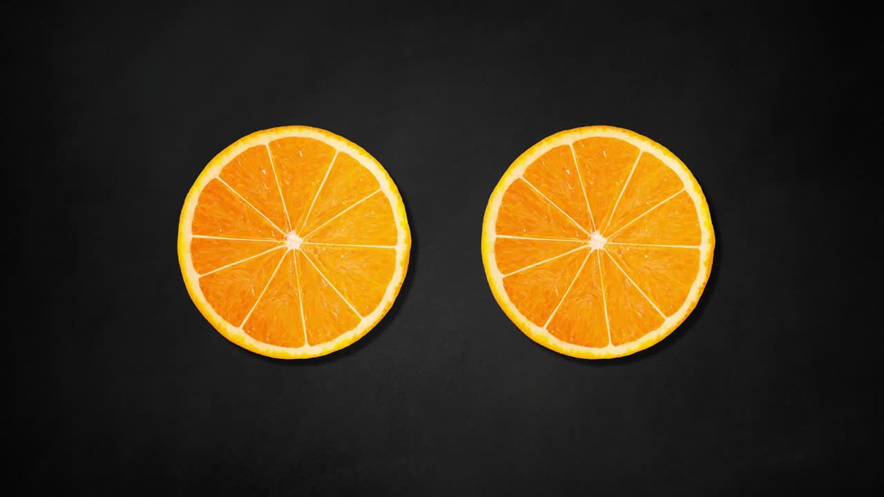 dos rebanadas de naranja girando