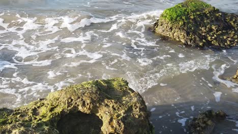 this is a slow motion video of waves crashing into rocks in galveston texas