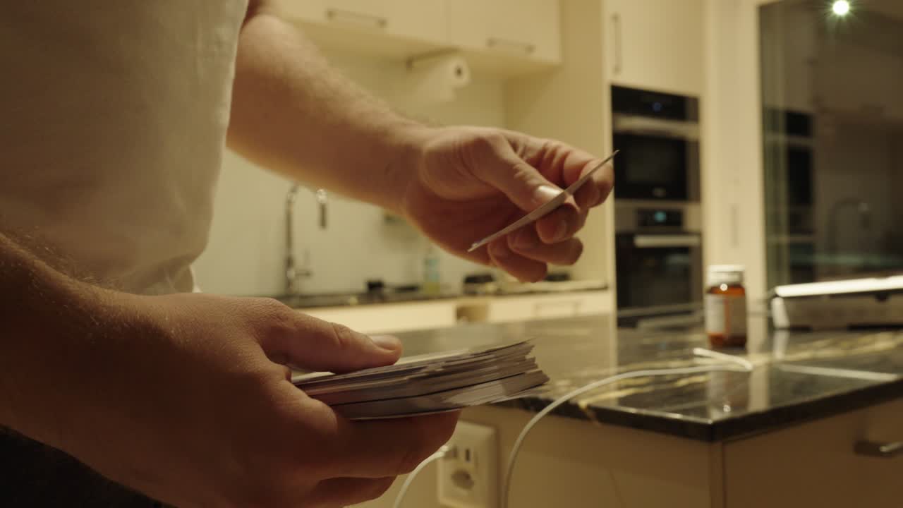 A man practices and tests himself using flashcards — concept of self-learning, memorization, and effective study methods