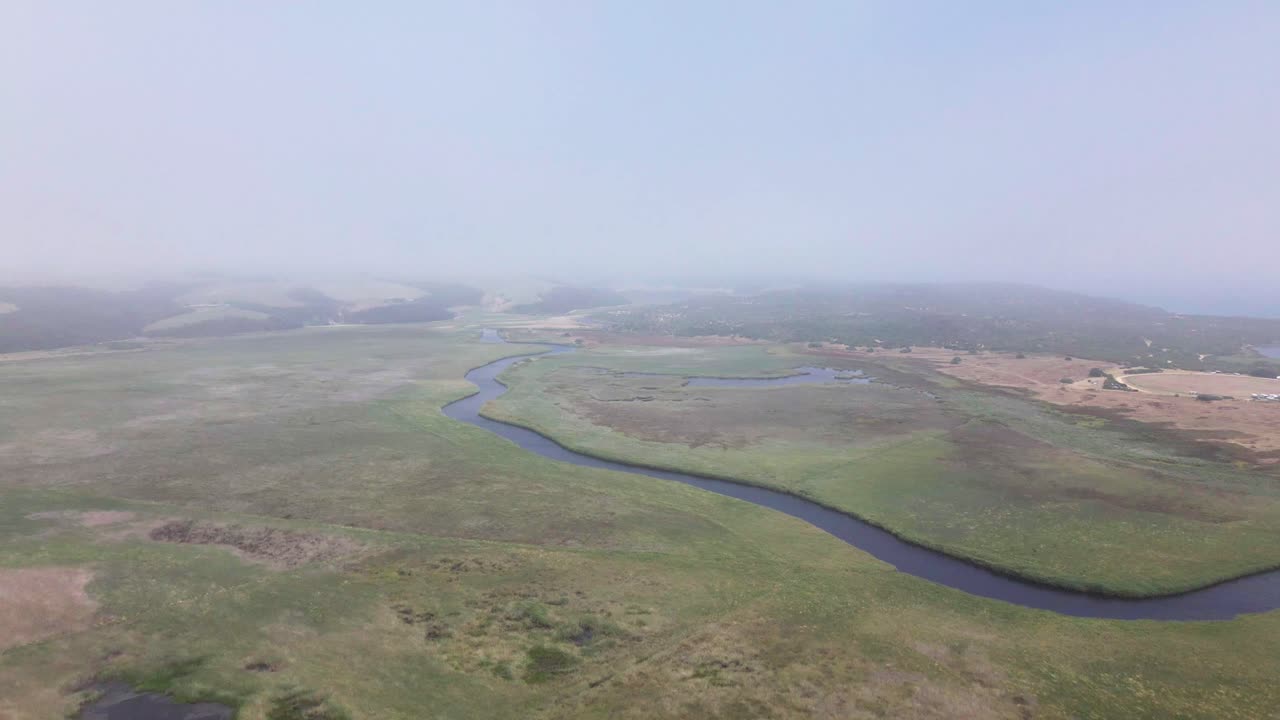 Drone flight over a meandering river in the marshlands | Premium Stock ...