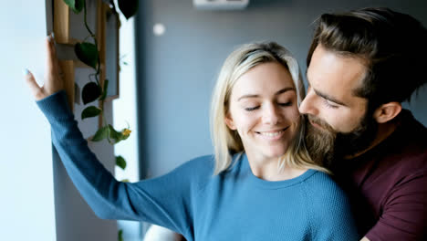 Couple-kissing-and-embracing-each-other-at-home-4k