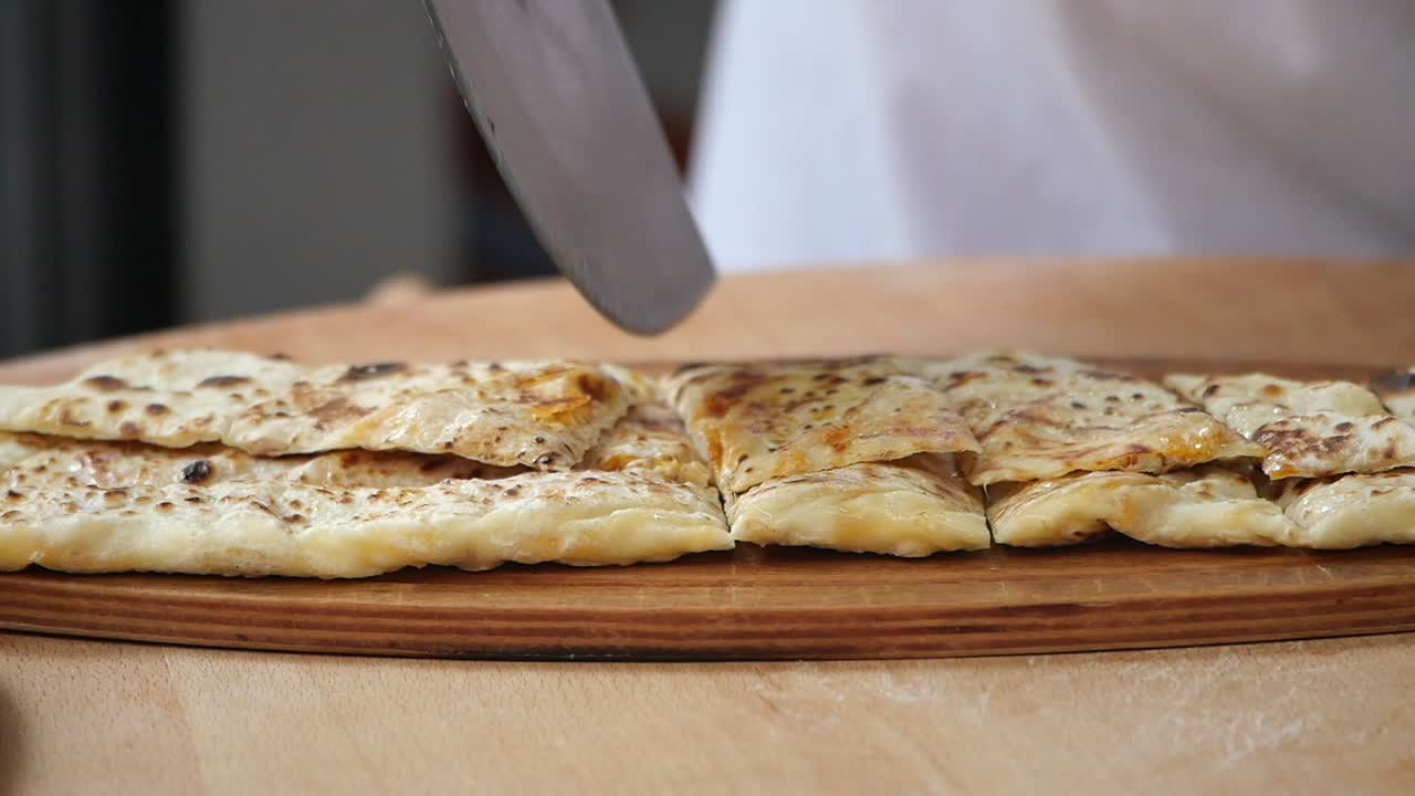 Cutting a Turkish Cheese Pide