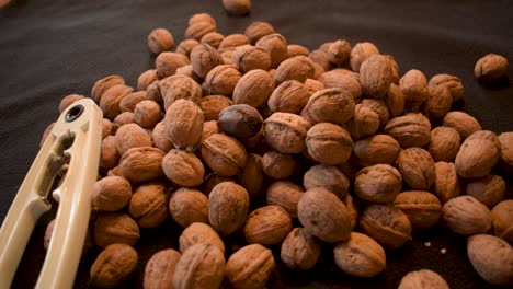 young man is cracking some fresh dried walnuts-1