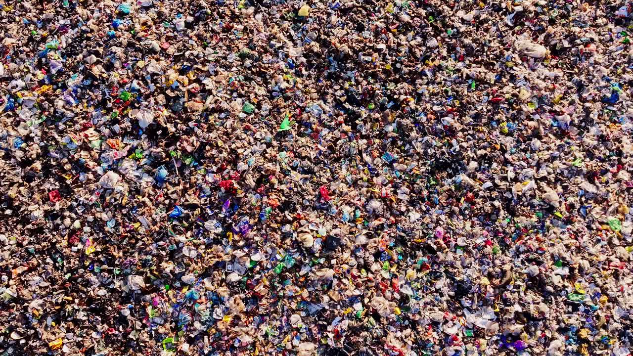 Drone aerial of landfill showing plastic pollution as urgent environmental risk