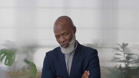 portrait-mature-african-american-businessman-boss-looking-serious-arms-crossed-confident-middle-aged-entrepreneur-in-office-slow-motion-corporate-manager