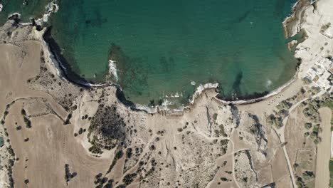 Sleepy-beach-town-overlooks-rolling-waves-and-crystal-clear-waters-on-the-Mediterranean