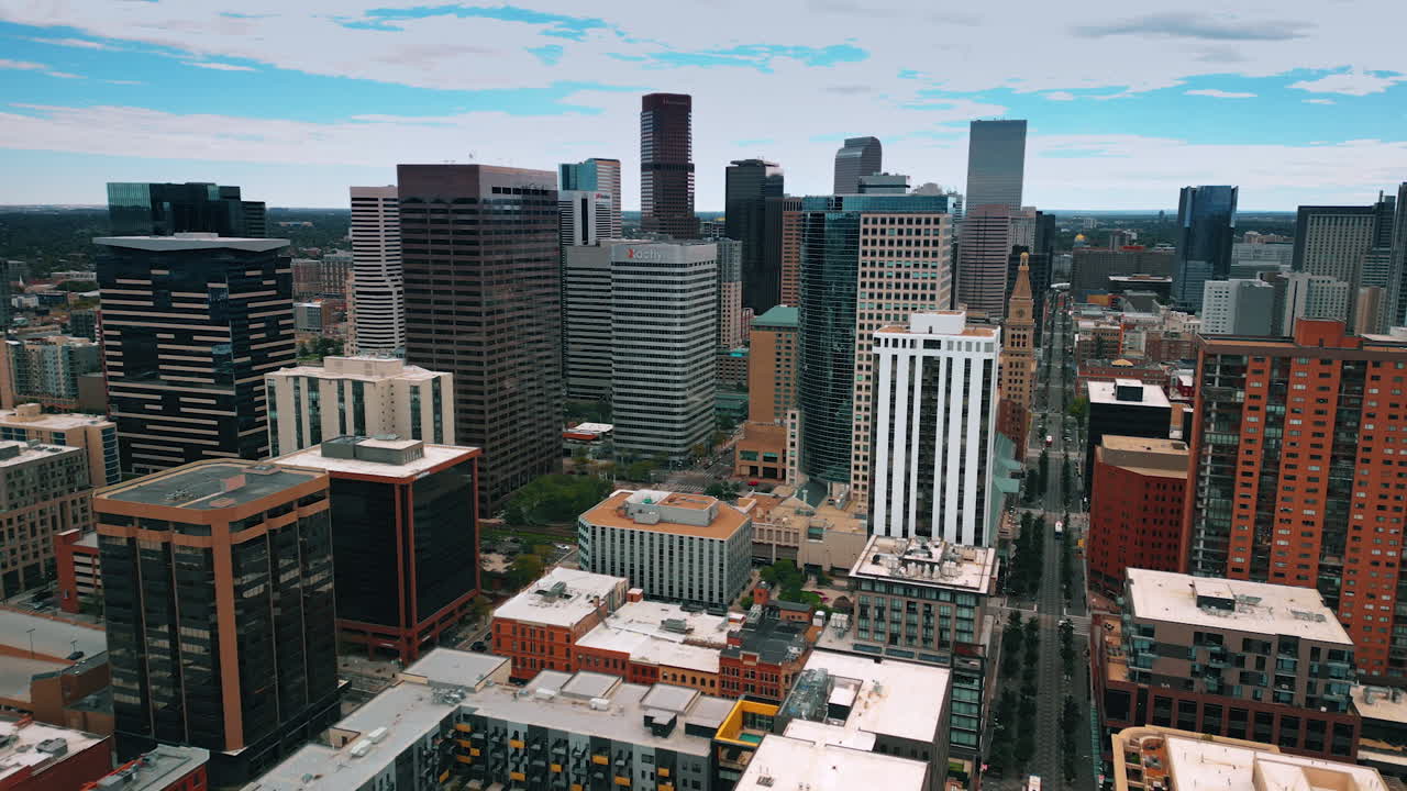 Denver, USA, 28 July 2025: View on the high-rise buildings in the downtown of Denver, Colorado, USA. Drone footage over the city on gloomy daytime