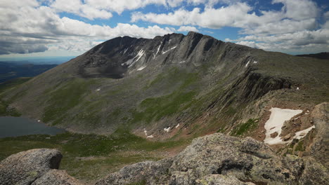 cinematic late morning denver mount evans snow summit echo chicago lakes 14er front range foothills rocky mountains idaho springs evergreen squaw pass slow motion wide scenic landscape pan to the left