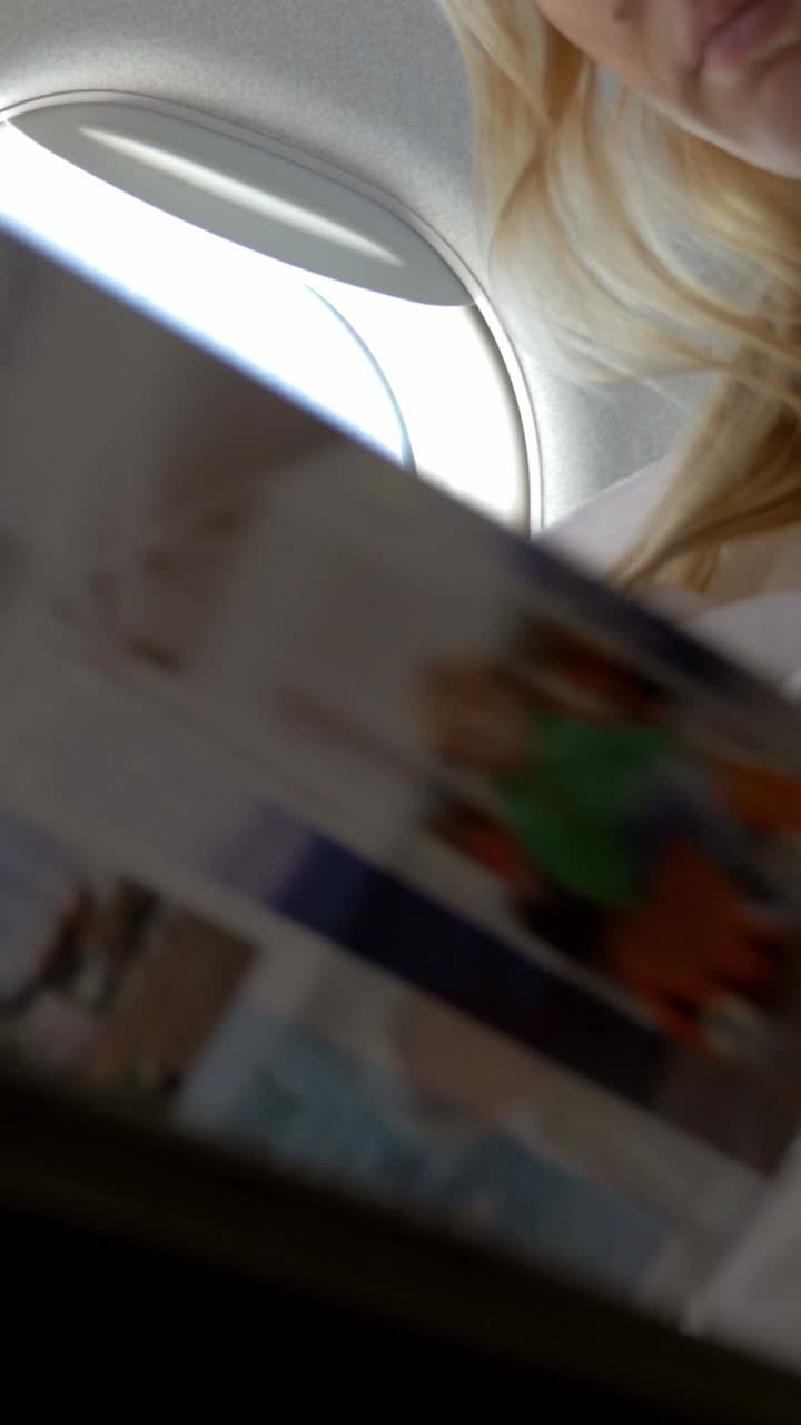 Woman Flying in Airplane