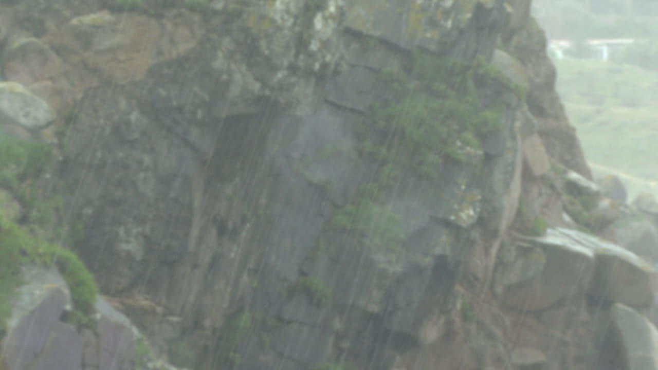 Rocky Cliff Face in Rain