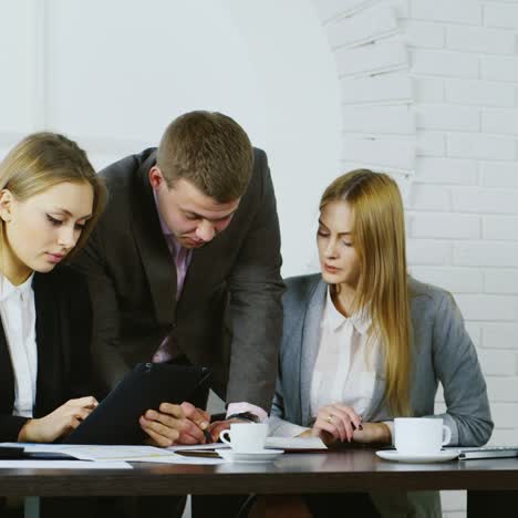 static shot of business colleagues discussing documents