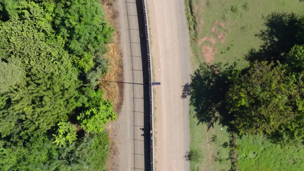 Above View Of Border Mesh Fence Between The Dominican Republic And Haiti, Dajabón Dominican Republic. Aerial Topdown Shot