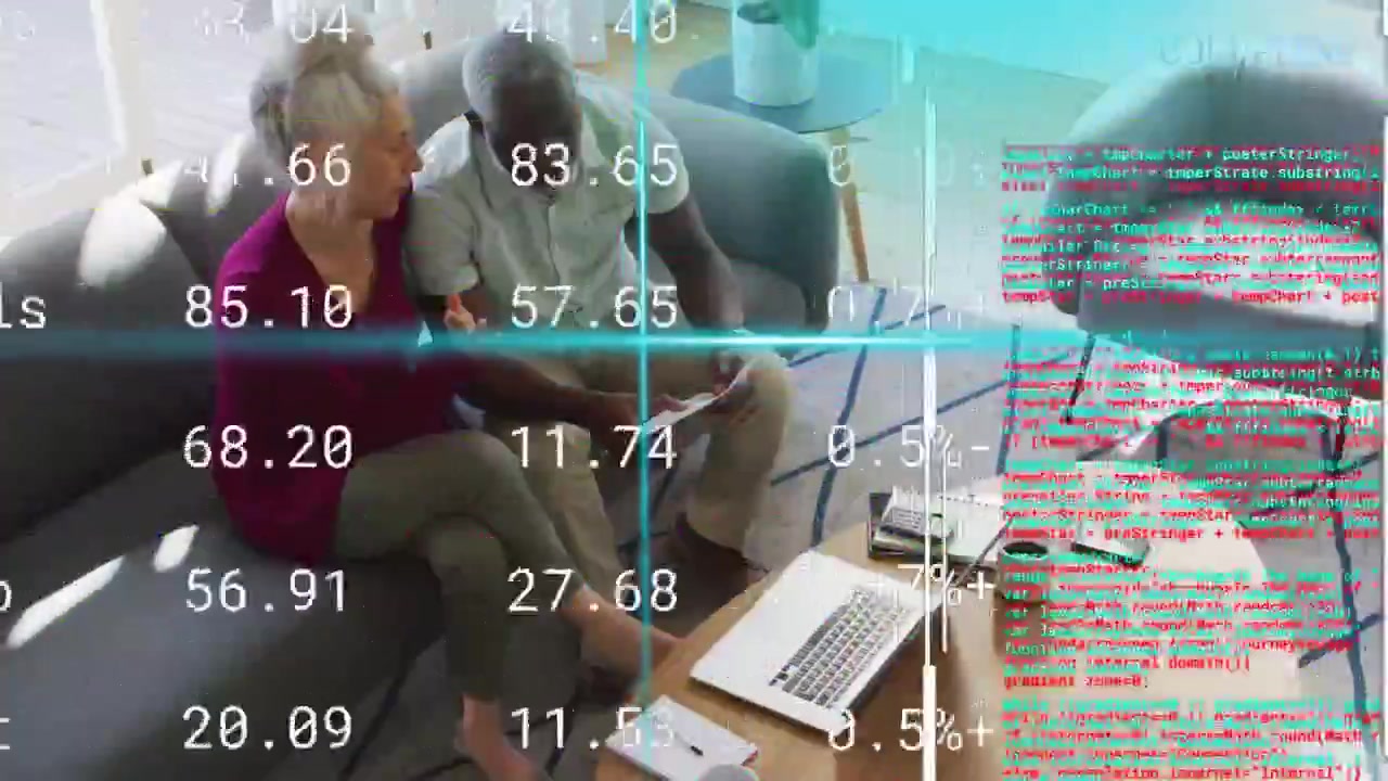 Couple leaning over laptop and papers while overlay scanning and marking numbers for finance review