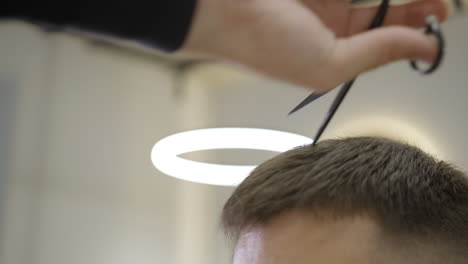 man getting a haircut at the barbershop