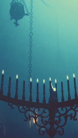 a close-up of an ornate candlestick with lit candles