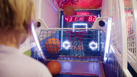 teen at the arcade basketball game