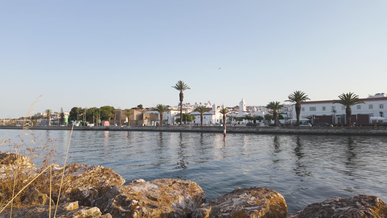Serene waterfront of Lagos Portugal in golden evening light