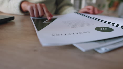 business woman hands reading portfolio