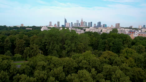 panoramic aerial view over green park and boulevard of warsaw skyline