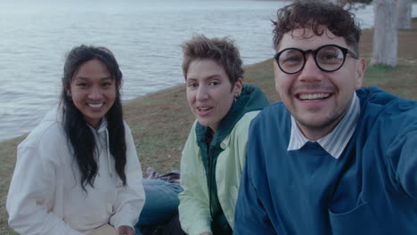pov of college friends taking on camera in the park